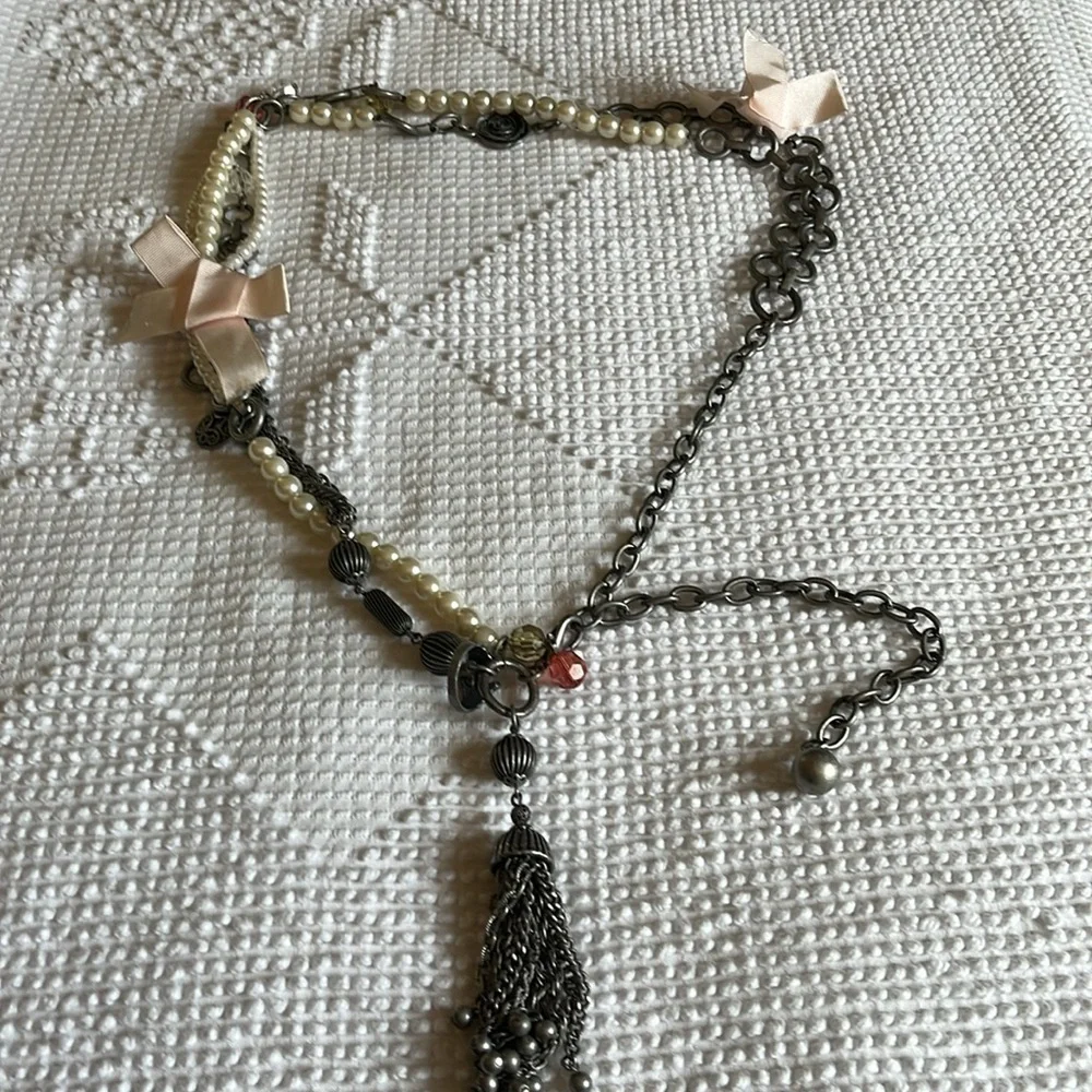 Women’s double chain belt. One of metal objects and the second chain of pearls.